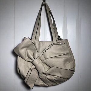 - Womens Light Tan Purse with Bow/Studs. Like New